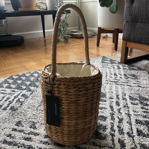 Round basket bag w/ handle from intentionally blnk